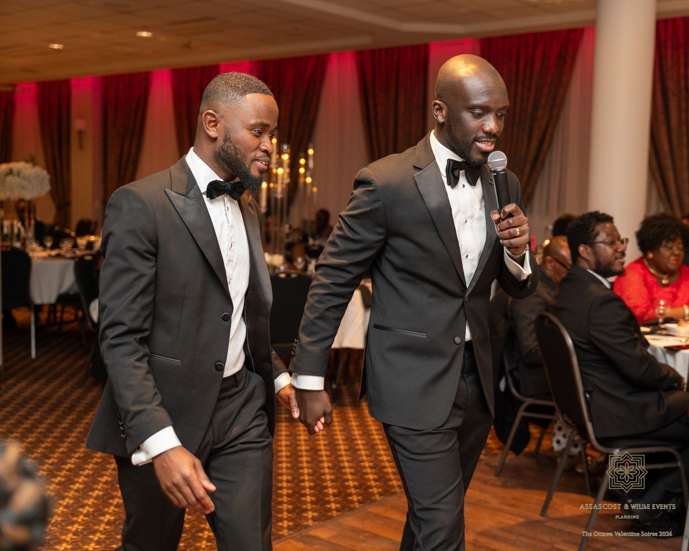 Two hosts in tuxedos walking through the ballroom at The Ottawa Valentine's Soirée
